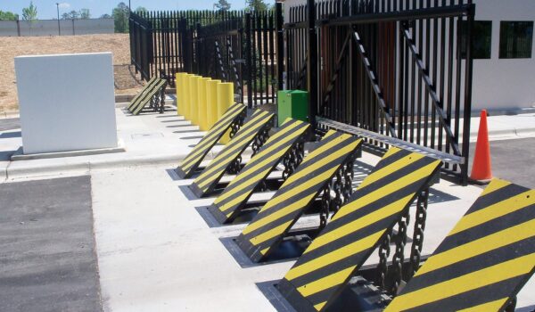 Wedge Barriers And Security Booth With Fencing